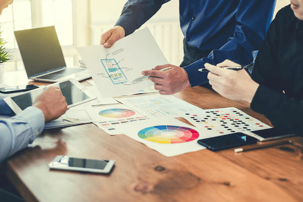 Business team designing marketing visuals with AI tools